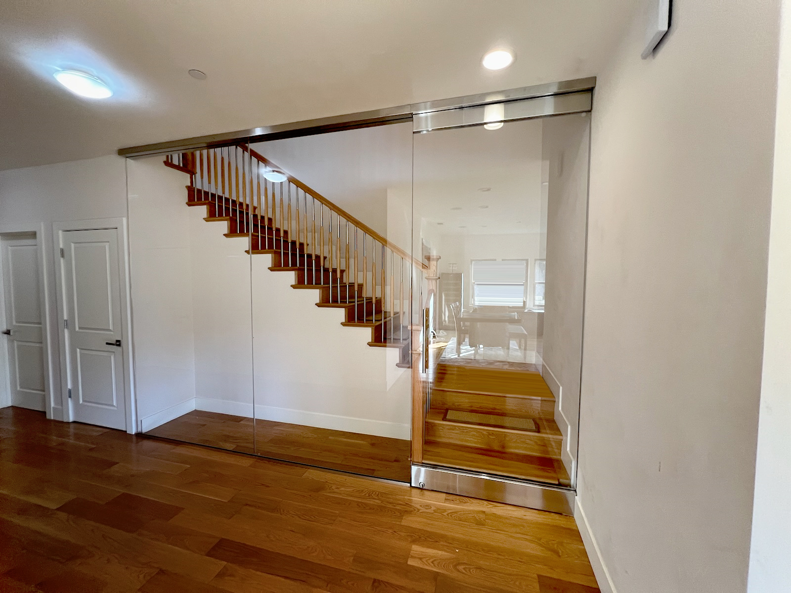 Swinging Hallway Glass Door and Glass panels for Staircase.